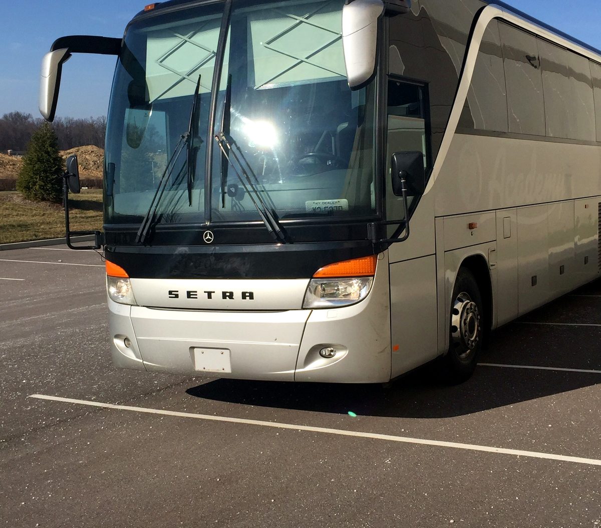 Silver Mercedes-Benz S417 coach parked in a lot, front view